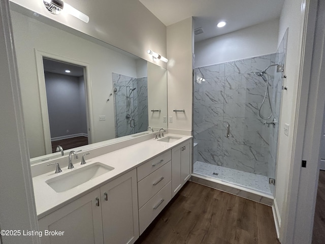 6355 Meeting St Unit 101, 201, Prospect, KY 40059 - bathroom featuring a marble finish shower, wood finished floors, double vanity, and recessed lighting