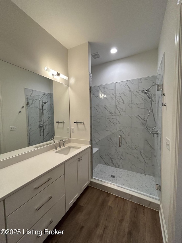 6355 Meeting St Unit 101, 201, Prospect, KY 40059 - full bathroom featuring wood finished floors, a marble finish shower, vanity, and recessed lighting
