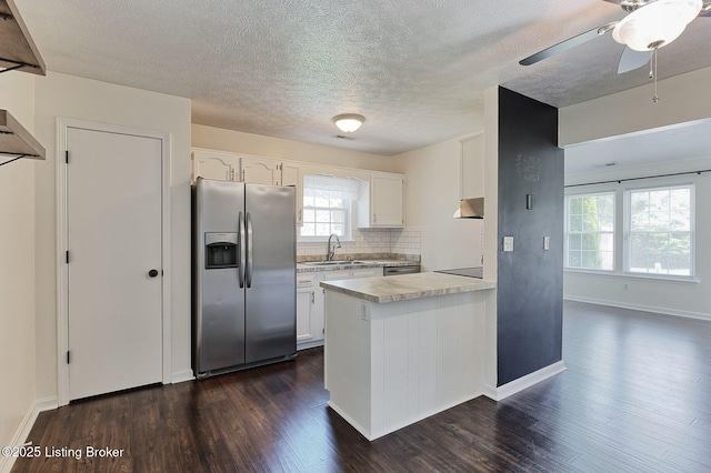 6604 Burlwood Dr, Louisville, KY 40229 - kitchen with stainless steel appliances, dark wood-type flooring, light countertops, white cabinets, and a peninsula