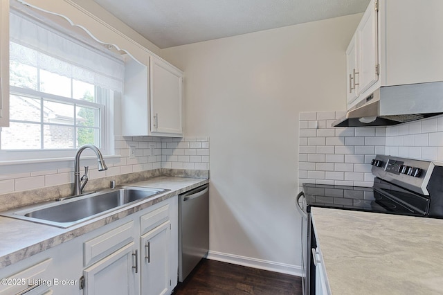 6604 Burlwood Dr, Louisville, KY 40229 - kitchen with appliances with stainless steel finishes, under cabinet range hood, white cabinets, light countertops, and dark wood-style floors