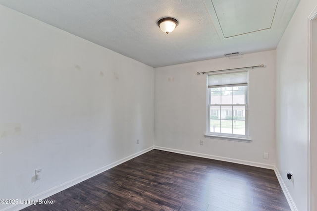 6604 Burlwood Dr, Louisville, KY 40229 - spare room featuring dark wood-style floors and a textured ceiling