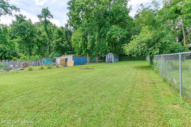 6604 Burlwood Dr, Louisville, KY 40229 - fenced backyard with a storage unit