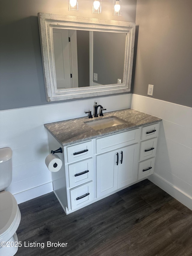 9530 Rocky Creek Ln, Louisville, KY 40299 - half bathroom with wood finished floors, vanity, and a wainscoted wall