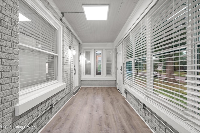 217 Shawnee Dr, Louisville, KY 40212 - unfurnished sunroom featuring ornamental molding, wood finished floors, and brick wall