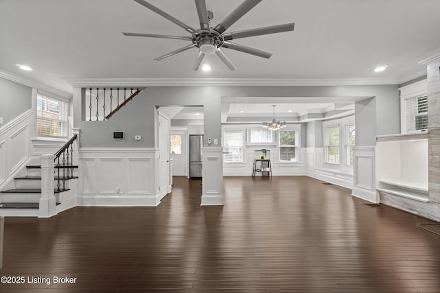 217 Shawnee Dr, Louisville, KY 40212 - unfurnished living room featuring dark wood-style flooring, stairway, a decorative wall, a chandelier, and a ceiling fan