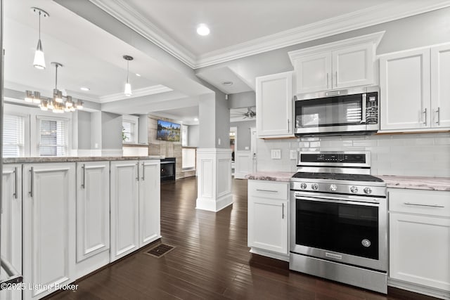 217 Shawnee Dr, Louisville, KY 40212 - kitchen with appliances with stainless steel finishes, ornamental molding, white cabinetry, dark wood-style flooring, and decorative backsplash