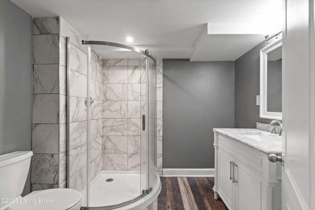 217 Shawnee Dr, Louisville, KY 40212 - bathroom featuring vanity, a stall shower, and wood finished floors