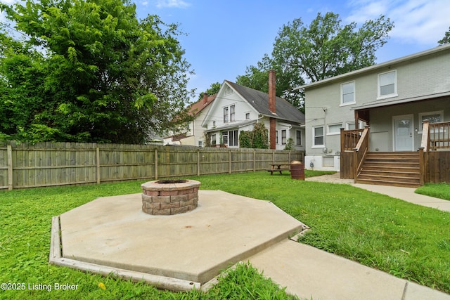 217 Shawnee Dr, Louisville, KY 40212 - fenced backyard featuring a fire pit and a patio area
