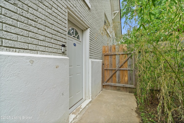 217 Shawnee Dr, Louisville, KY 40212 - doorway to property with a gate and brick siding
