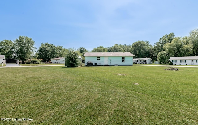 330 W Cardinal Ct, Madison, IN 47250 - view of green lawn featuring view of wooded area