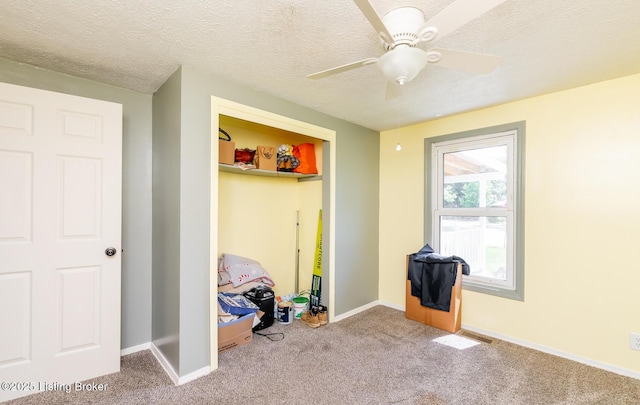 330 W Cardinal Ct, Madison, IN 47250 - unfurnished bedroom featuring carpet flooring, a closet, a textured ceiling, and a ceiling fan