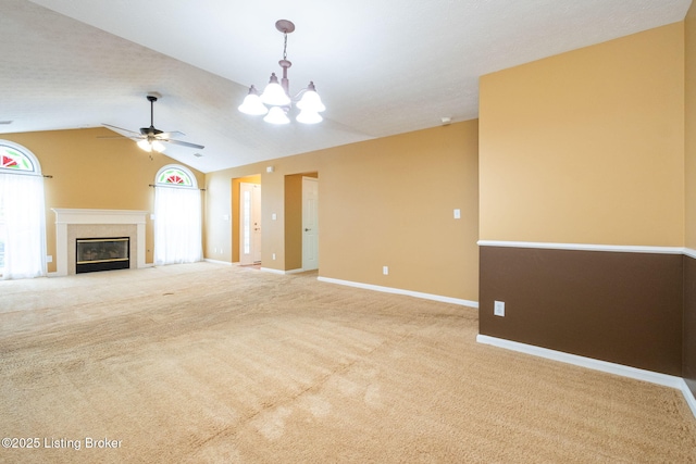 13702 Beowulf Ct, Louisville, KY 40299 - unfurnished living room with healthy amount of natural light, ceiling fan, carpet flooring, a chandelier, and vaulted ceiling