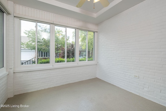 13702 Beowulf Ct, Louisville, KY 40299 - unfurnished sunroom with brick wall and carpet flooring