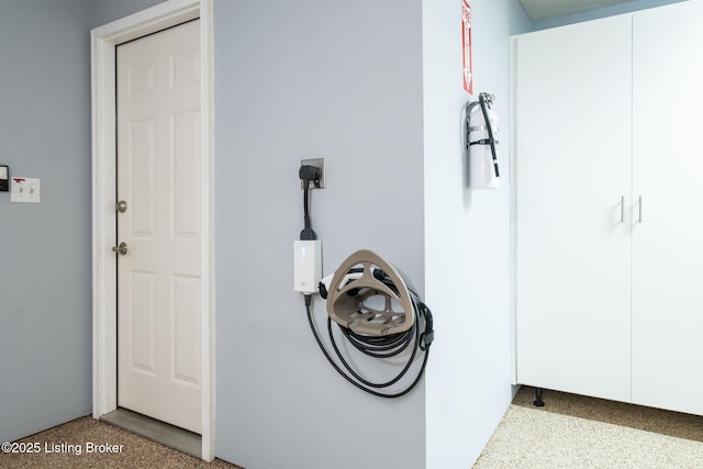 13702 Beowulf Ct, Louisville, KY 40299 - detailed view of a fire extinguisher and speckle patterned floor
