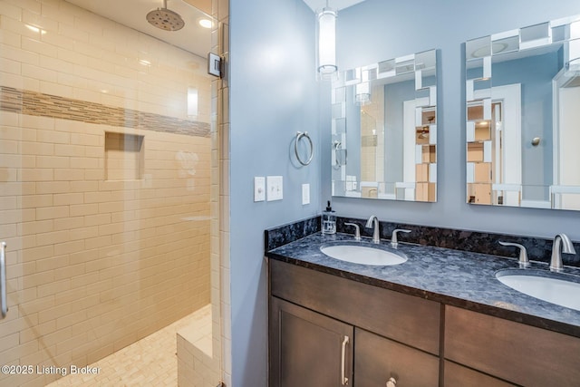 415 E Market St Unit 104, Louisville, KY 40202 - full bathroom with a tile shower and double vanity