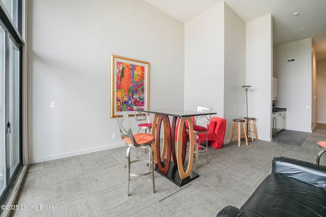 415 E Market St Unit 104, Louisville, KY 40202 - rec room with carpet floors and a high ceiling