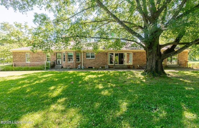 606 N Arbor Dr, Louisville, KY 40223 - view of front facade featuring a front lawn and brick siding