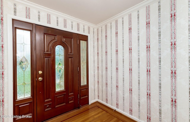 606 N Arbor Dr, Louisville, KY 40223 - entrance foyer with light wood finished floors, wallpapered walls, and ornamental molding