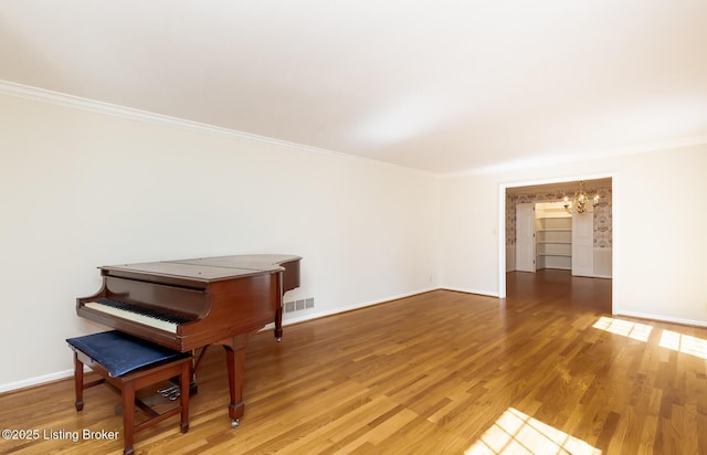 606 N Arbor Dr, Louisville, KY 40223 - living area with a chandelier, ornamental molding, and light wood-style floors