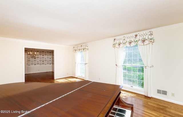 606 N Arbor Dr, Louisville, KY 40223 - unfurnished dining area featuring a chandelier, wood finished floors, and crown molding