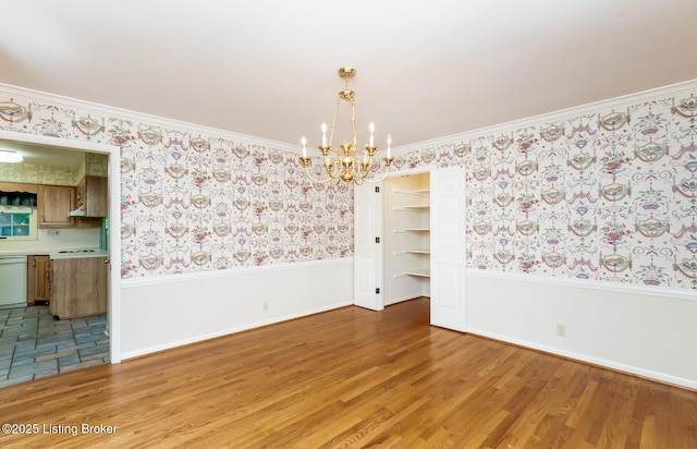 606 N Arbor Dr, Louisville, KY 40223 - spare room featuring a chandelier, wainscoting, wallpapered walls, light wood-style floors, and crown molding