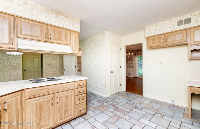 606 N Arbor Dr, Louisville, KY 40223 - kitchen featuring white electric stovetop, wallpapered walls, light countertops, and light brown cabinetry