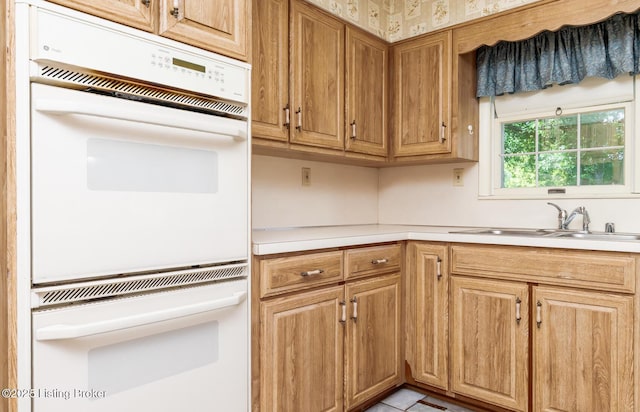 606 N Arbor Dr, Louisville, KY 40223 - kitchen with light countertops, double oven, and brown cabinets