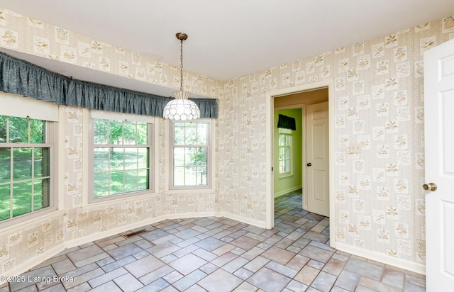 606 N Arbor Dr, Louisville, KY 40223 - unfurnished room featuring wallpapered walls and a chandelier