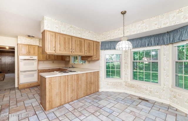 606 N Arbor Dr, Louisville, KY 40223 - kitchen with wallpapered walls, white appliances, a peninsula, stone finish floors, and light countertops