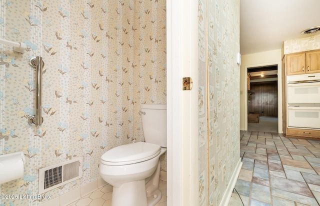 606 N Arbor Dr, Louisville, KY 40223 - bathroom with toilet and wallpapered walls