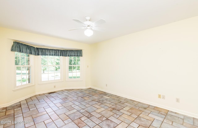 606 N Arbor Dr, Louisville, KY 40223 - empty room featuring a ceiling fan and stone finish flooring