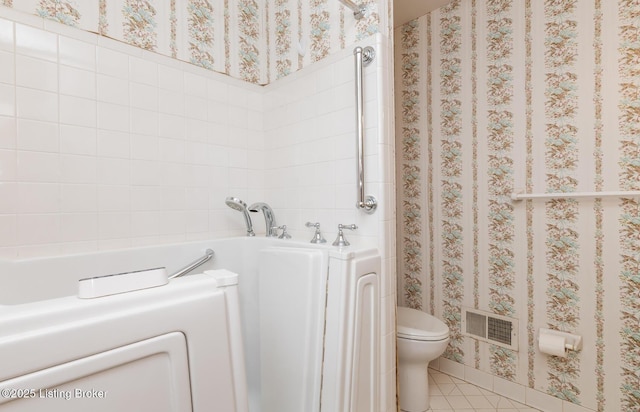 606 N Arbor Dr, Louisville, KY 40223 - bathroom featuring washer / clothes dryer, a garden tub, and tile patterned flooring