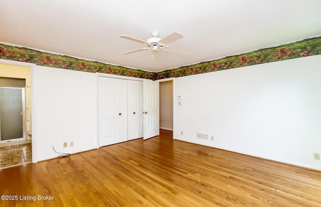 606 N Arbor Dr, Louisville, KY 40223 - unfurnished bedroom featuring light wood-type flooring, a closet, a ceiling fan, and connected bathroom