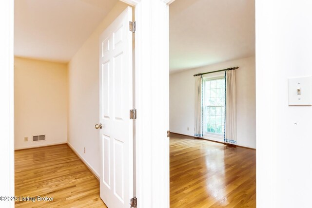 606 N Arbor Dr, Louisville, KY 40223 - corridor with light wood-style flooring and baseboards