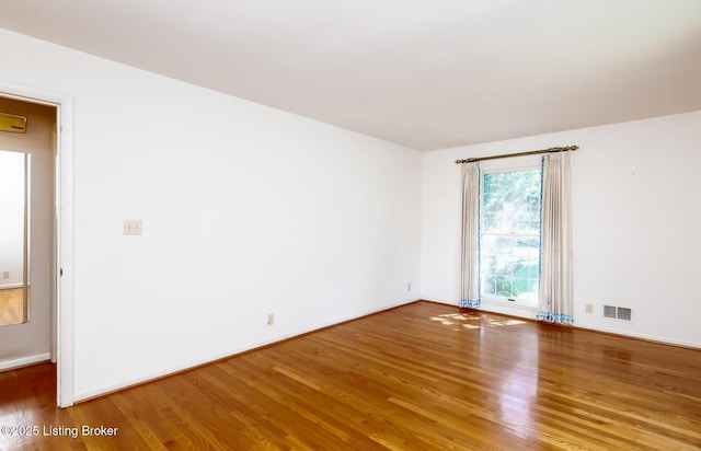 606 N Arbor Dr, Louisville, KY 40223 - spare room featuring wood finished floors