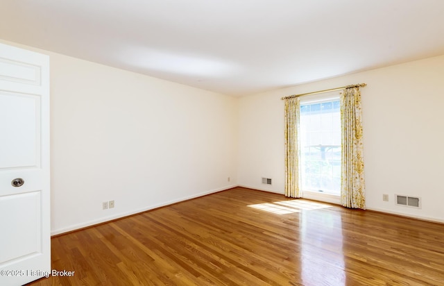 606 N Arbor Dr, Louisville, KY 40223 - unfurnished room with wood finished floors and baseboards