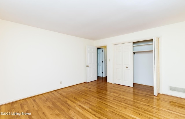 606 N Arbor Dr, Louisville, KY 40223 - unfurnished bedroom featuring light wood finished floors and a closet