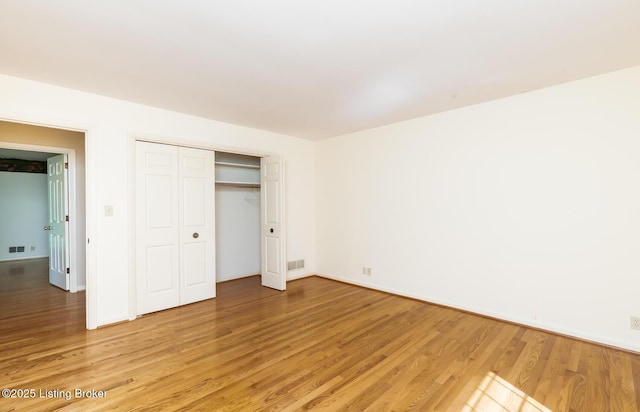 606 N Arbor Dr, Louisville, KY 40223 - unfurnished bedroom with light wood-style flooring and a closet
