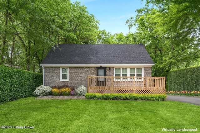 1215 Vim Dr, Louisville, KY 40213 - view of front of home with brick siding, a front yard, and a shingled roof