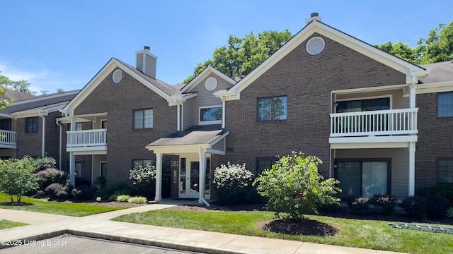 410 Ethridge Ave Unit 103, Louisville, KY 40223 - view of front facade with brick siding and a chimney