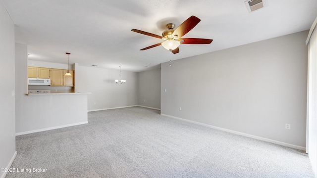 410 Ethridge Ave Unit 103, Louisville, KY 40223 - unfurnished living room with a ceiling fan, light carpet, and a chandelier