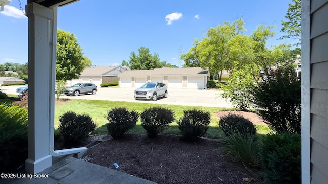 410 Ethridge Ave Unit 103, Louisville, KY 40223 - view of grassy yard featuring community garages