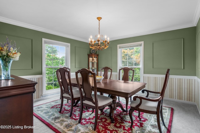 3012 Hayfield Dr, Louisville, KY 40205 - dining area with healthy amount of natural light, a chandelier, ornamental molding, light carpet, and wainscoting