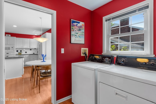 3012 Hayfield Dr, Louisville, KY 40205 - laundry room with light wood-style floors and washing machine and dryer