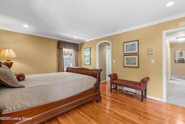 3012 Hayfield Dr, Louisville, KY 40205 - bedroom with ornamental molding, wood finished floors, recessed lighting, and arched walkways