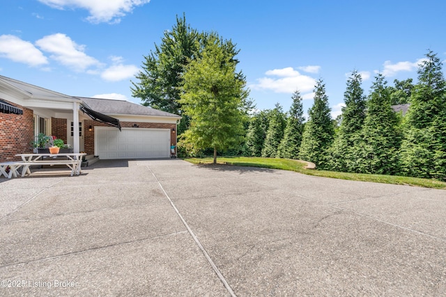 3012 Hayfield Dr, Louisville, KY 40205 - view of side of home with a garage, brick siding, and driveway