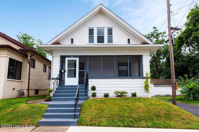 412 Gwendolyn St, Louisville, KY 40203 - view of front of home with a front lawn and a sunroom