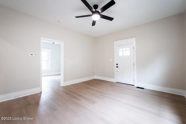 412 Gwendolyn St, Louisville, KY 40203 - empty room featuring ceiling fan, healthy amount of natural light, and wood finished floors