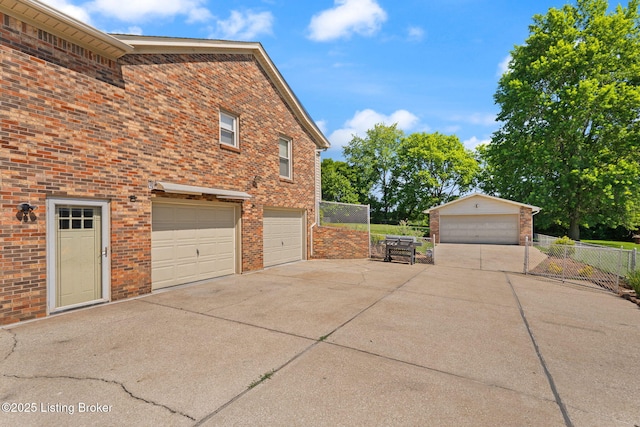 3941 Scenic Trl, Shepherdsville, KY 40165 - view of side of property with brick siding, concrete driveway, and an attached garage