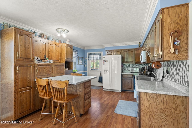 3941 Scenic Trl, Shepherdsville, KY 40165 - kitchen featuring white appliances, light countertops, crown molding, dark wood finished floors, and a textured ceiling